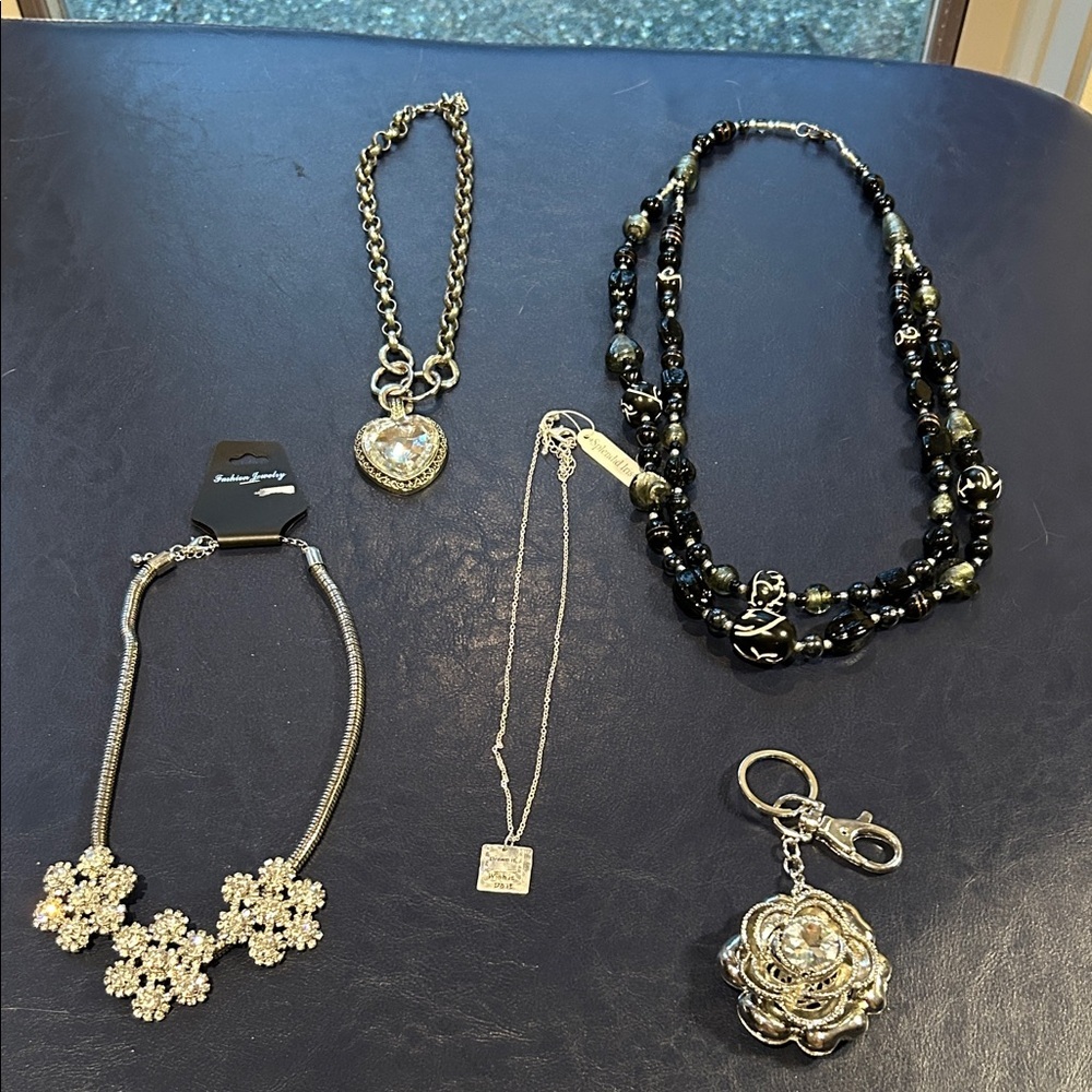 Bundle of Bling 4 necklaces and key chain.   Silver and Black 3 with tags.